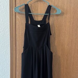 Chic Black Waffle Knit Jumpsuit with Button-Strap Detail